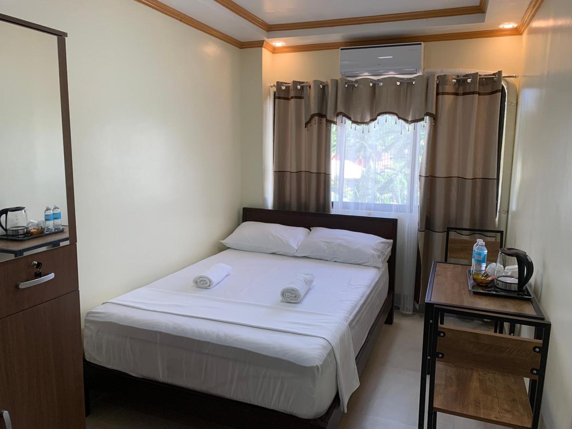 Zl Travelers Inn Batuan Exterior foto