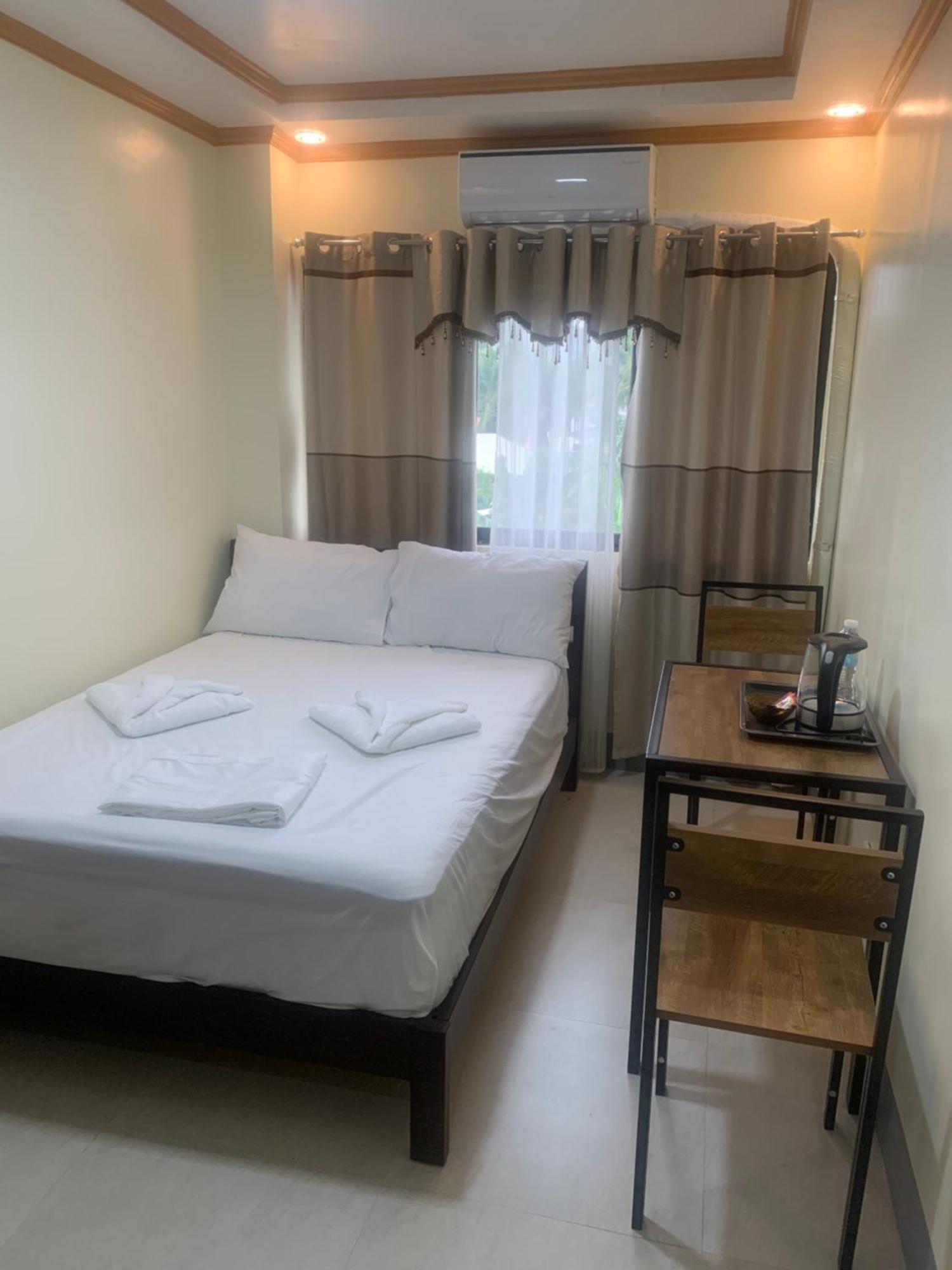 Zl Travelers Inn Batuan Exterior foto